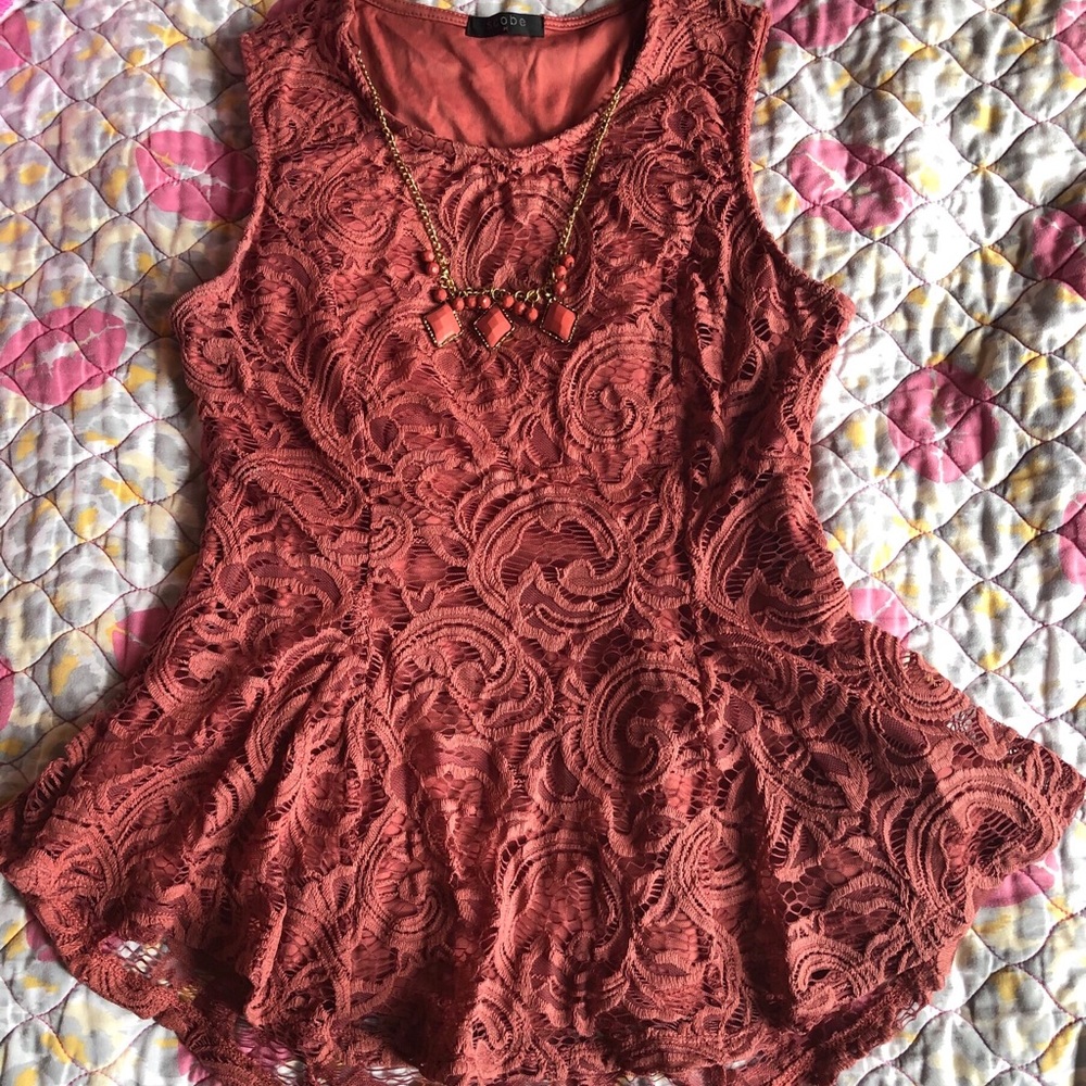 Burnt orange and pink lace blouse.